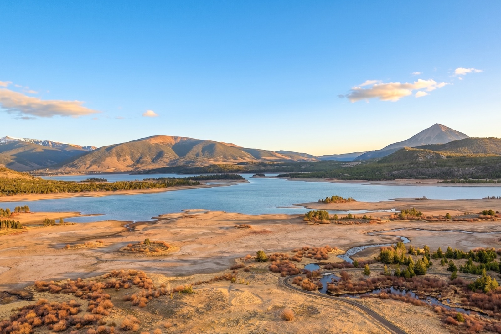 Aerial view of Dillon Reservoir and surrounding mountains at golden hour